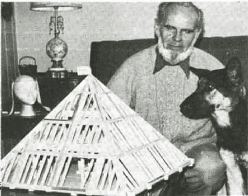 Les Brown with model pyramid and his dog